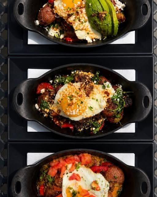 Three cast-iron breakfast skillets, freshly plated