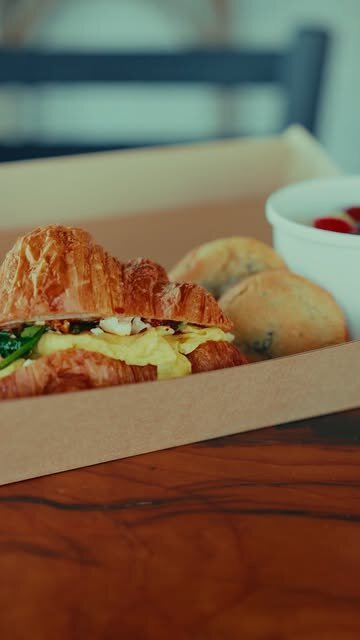 Croissant sandwich in a to-go box